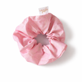 Load image into Gallery viewer, Pink scrunchie with a brand tag on a white background