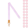 Load image into Gallery viewer, Pink and white checkered lanyard with a gold clip on a white background