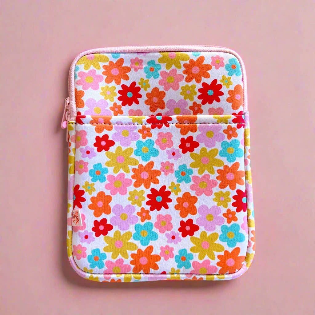Floral patterned pouch on a pink background