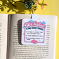 Sticker with 'We Listen & We Don't Judge' text on an open book with a yellow background