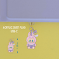 Acrylic dust plug with a cute character design on a green background
