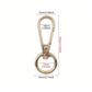 Gold metal keychain with dimensions labeled on a white background