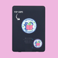 Black phone grip with 'Antisocial Butterfly' design on a pink background