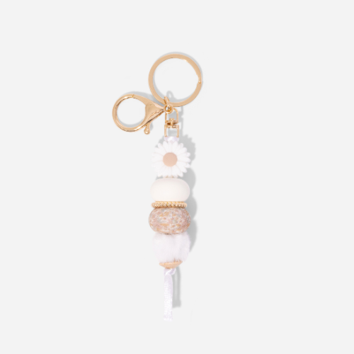 Keychain with decorative beads on a white background