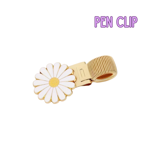 Gold pen clip with a daisy design on a white background