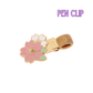 Pen clip with floral design on a white background
