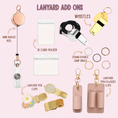 Load image into Gallery viewer, Collection of lanyard add-ons including a mini badge reel, ID card holder, whistles, and various clips on a pink background.
