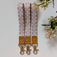 retro orange checker floral patterns, laid on pastel notebooks with floral accents – Lilly Jayne Collective.