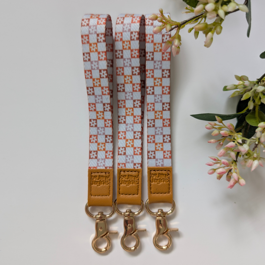 retro orange checker floral patterns, laid on pastel notebooks with floral accents – Lilly Jayne Collective.