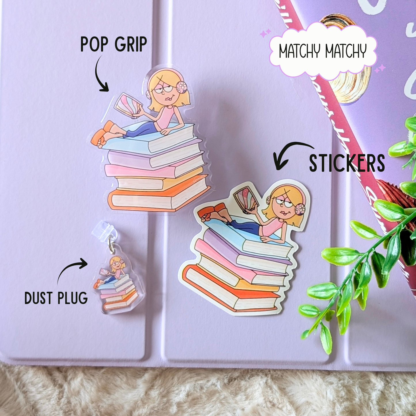 Set of stickers with a design of a person sitting on books, labeled 'Pop Grip', 'Matchy Matchy', and 'Dust Plug'.