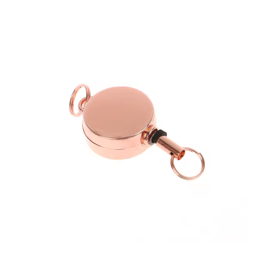 Rose gold retractable keychain on a white background