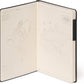 Open notebook with world map design on beige pages, black binding
