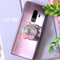 Phone case with cherry design and 'POP GRIP' text on a light purple background