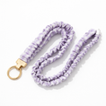 Load image into Gallery viewer, Lavender tie-dye keychain with gold clasp on a white background
