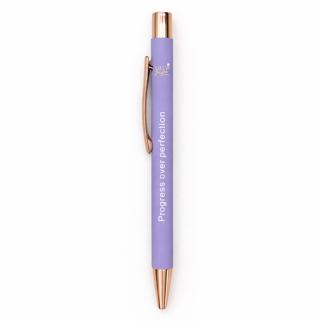 Purple pen with rose gold accents on a white background