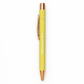 Yellow pen with rose gold accents on a white background