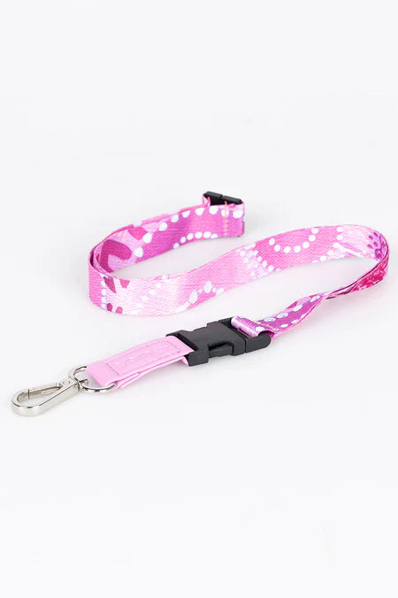 Pink and white patterned lanyard with a black clip on a white background