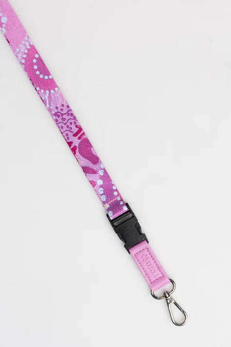 Pink lanyard with black strap on a white background