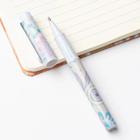 Decorative pen with a notebook on a white background