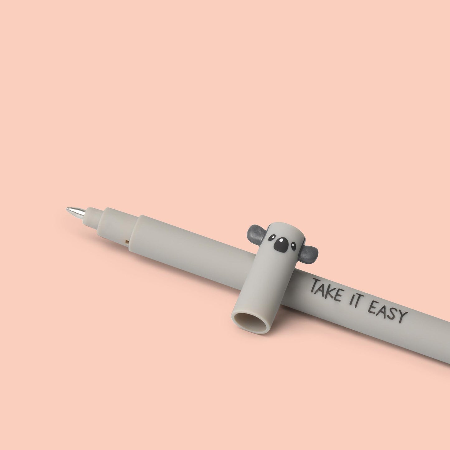 Gray pen with a cute animal design on the cap and 'Take It Easy' text on a pink background