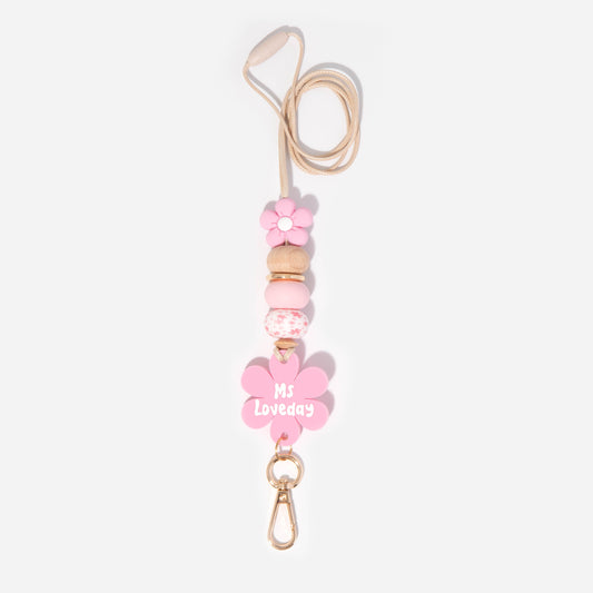 Lanyard with pink flower silicone focal beads and a matching pink flower personalised name disc. With wooden Bead and pretty pink silicone beads.