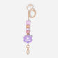 Lanyard with purple flower silicone focal beads and a matching purple flower personalised name disc. With wooden Bead and pretty floral and purple silicone beads.