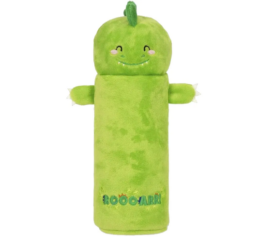 Green plush toy resembling a cucumber with a smiling face on a white background