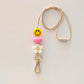  Smiley face lanyard with gold clip and pink and white beads 