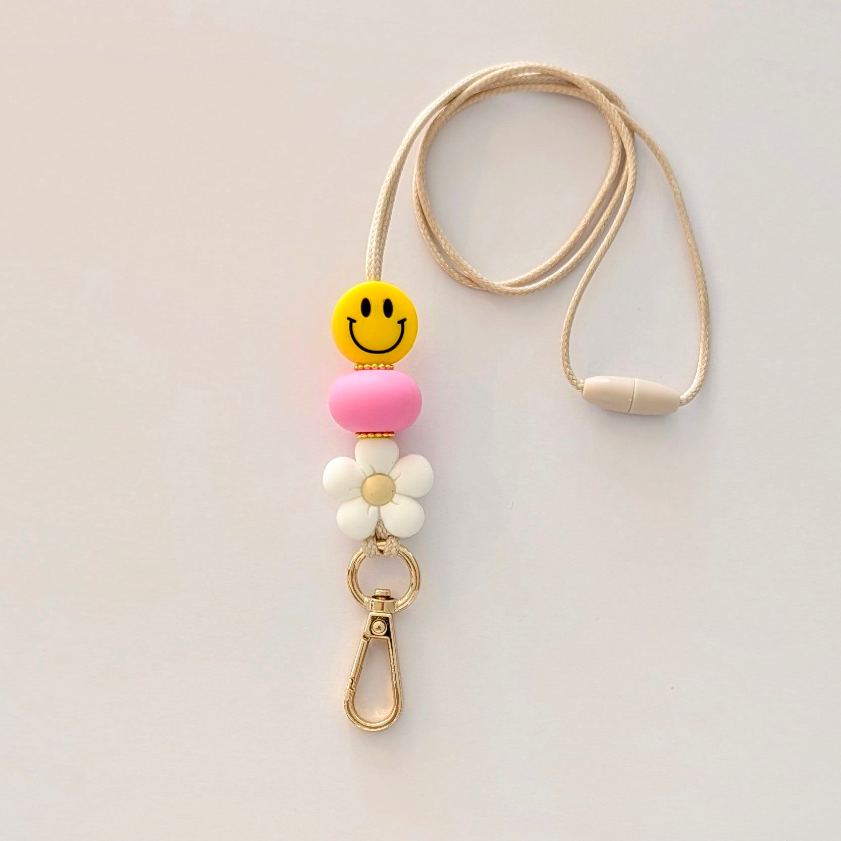  Smiley face lanyard with gold clip and pink and white beads 