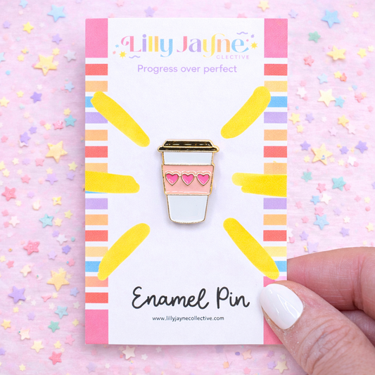Enamel pin with a coffee cup design on a colorful card with 'Lilly Jayne Collective' branding.
