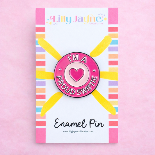 Enamel pin with heart design on a colorful card with 'Lilly Jayne Collective' branding.