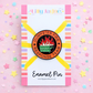Enamel pin with 'Dumpster Fire Response Team' design on a colorful card with stars.