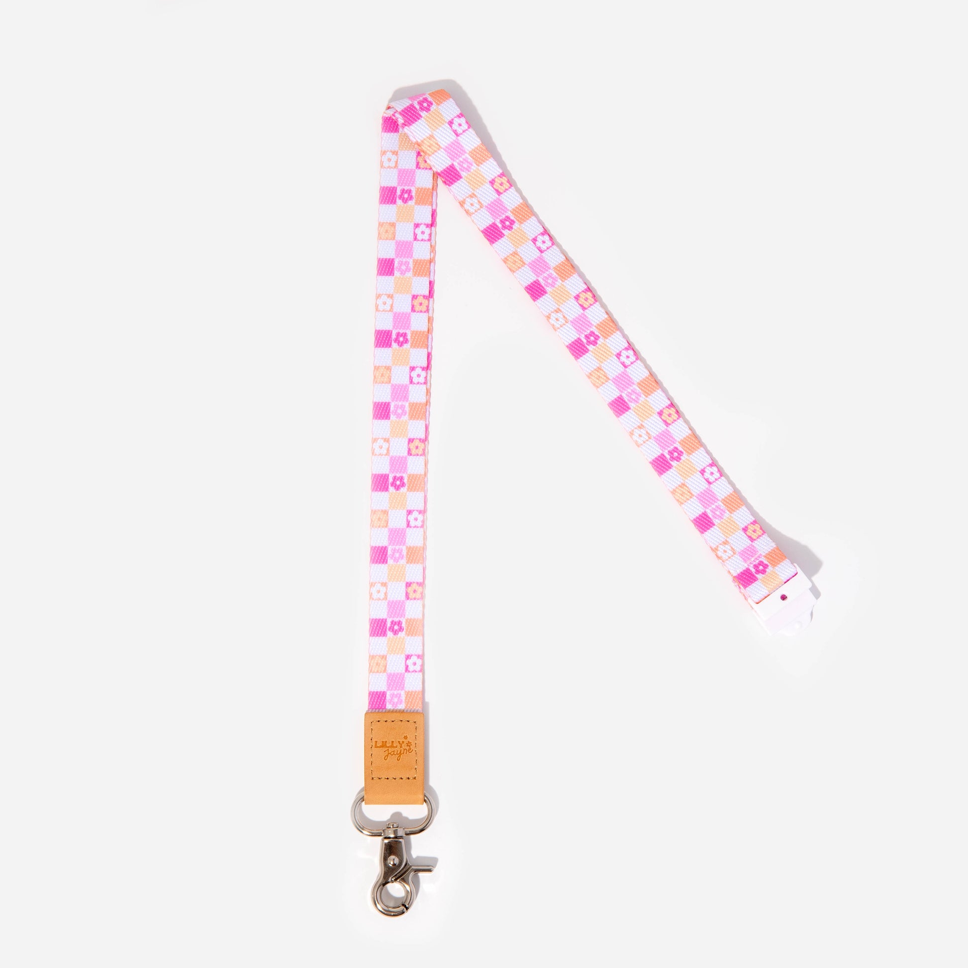 A colorful geometric patterned lanyard with a faux leather trim, silver clasp, and breakaway safety clasp.