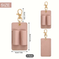 Pink leather keychain with dimensions and clip on a white background
